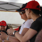 Female instructor showing female shooter proper grip